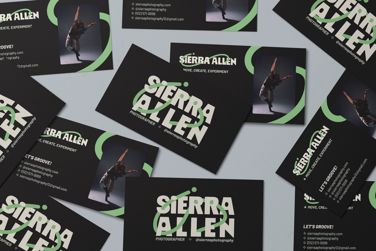 Sierra Allen business cards in black with a green swoosh, scattered on a table