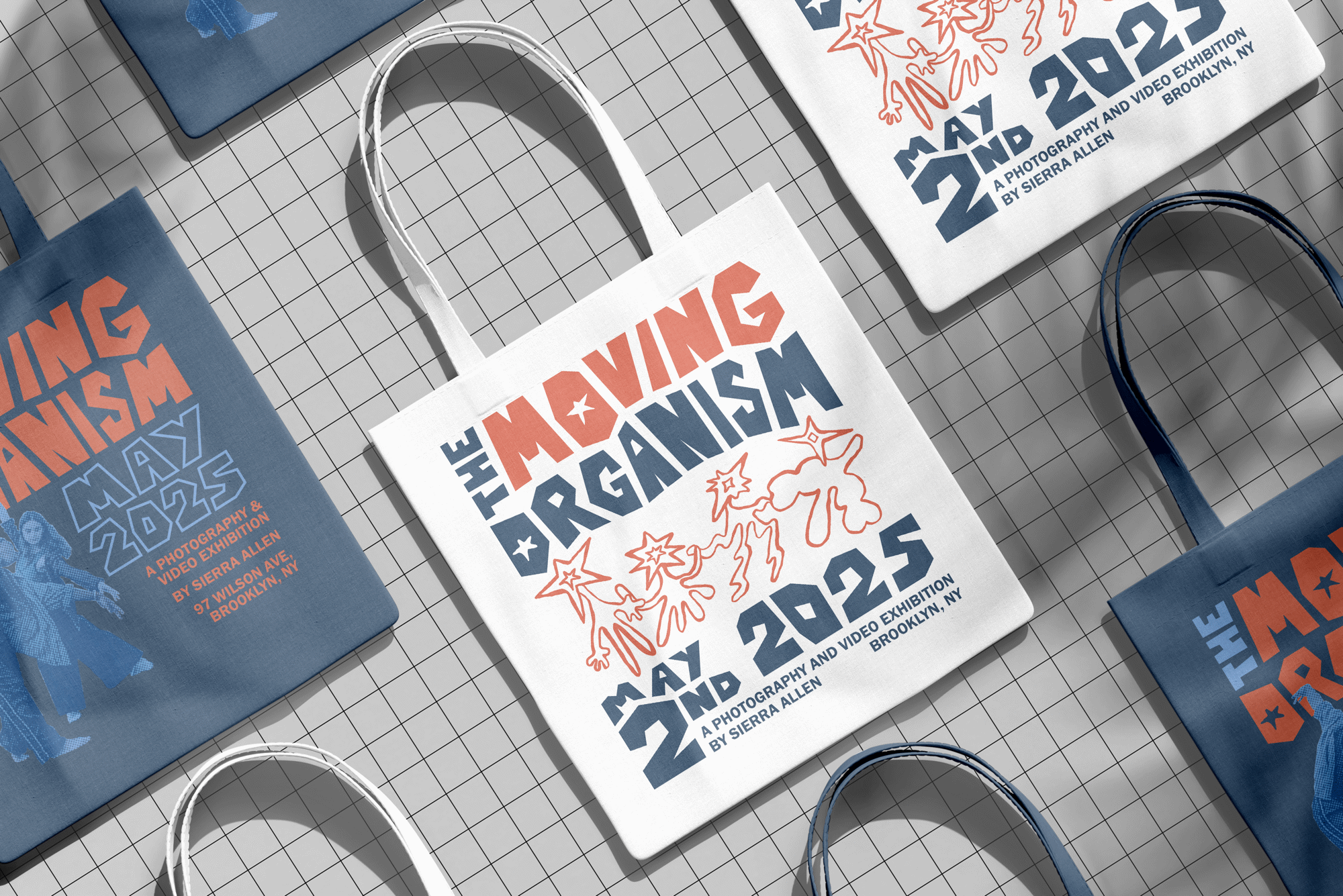 White and navy tote bags printed with the wordmark, the exhibition date and halftone dancer photos