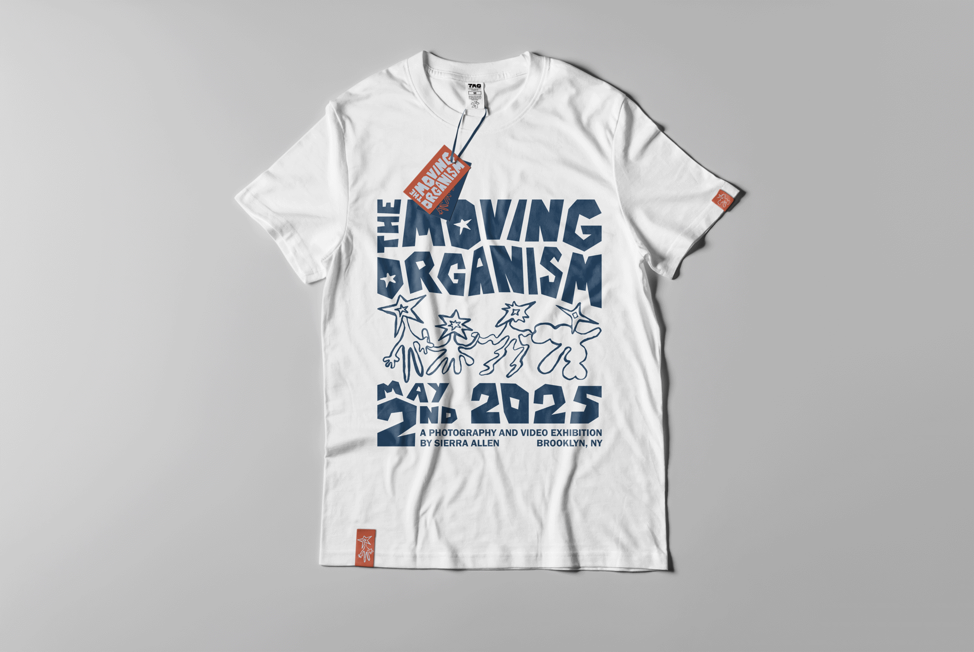 White T-shirt printed in navy with the stacked wordmark, the dancing-figures doodle and the exhibition date